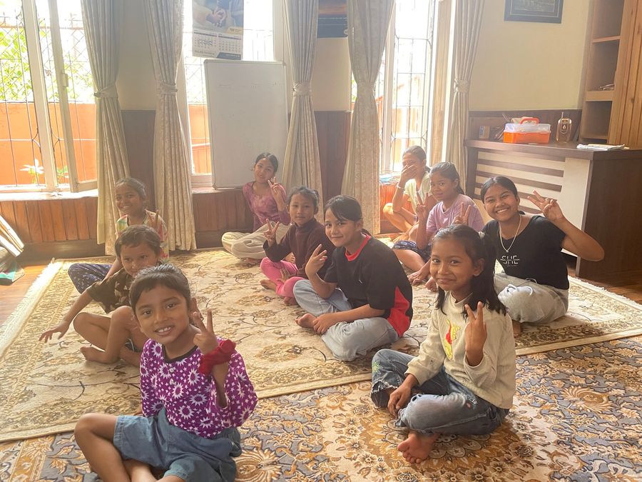 Girls of the hostel house together in the living room