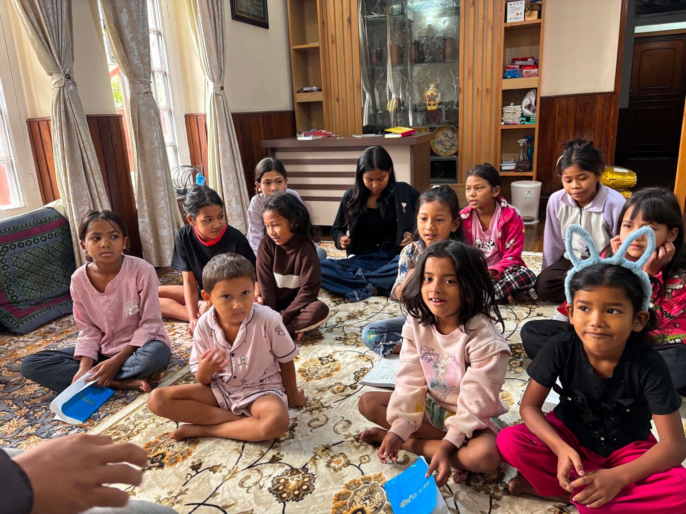 Children of the TSP Orphan Home gathered for devotion time in the living room
