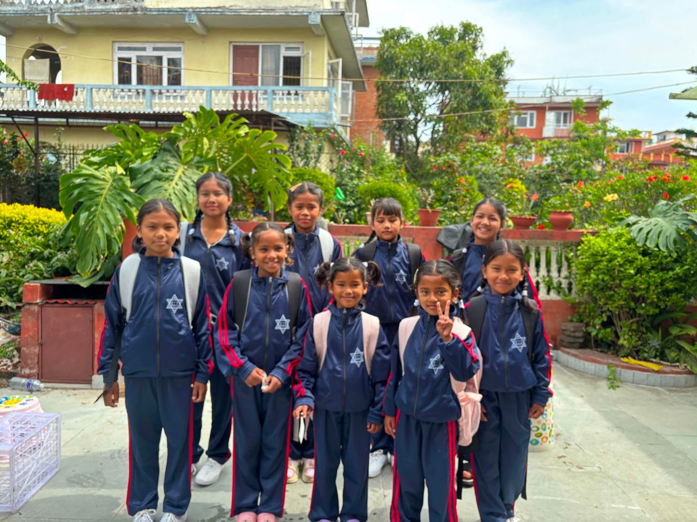 Girls from the TSP Orphan Home in school uniforms, ready for school in Lalitpur
