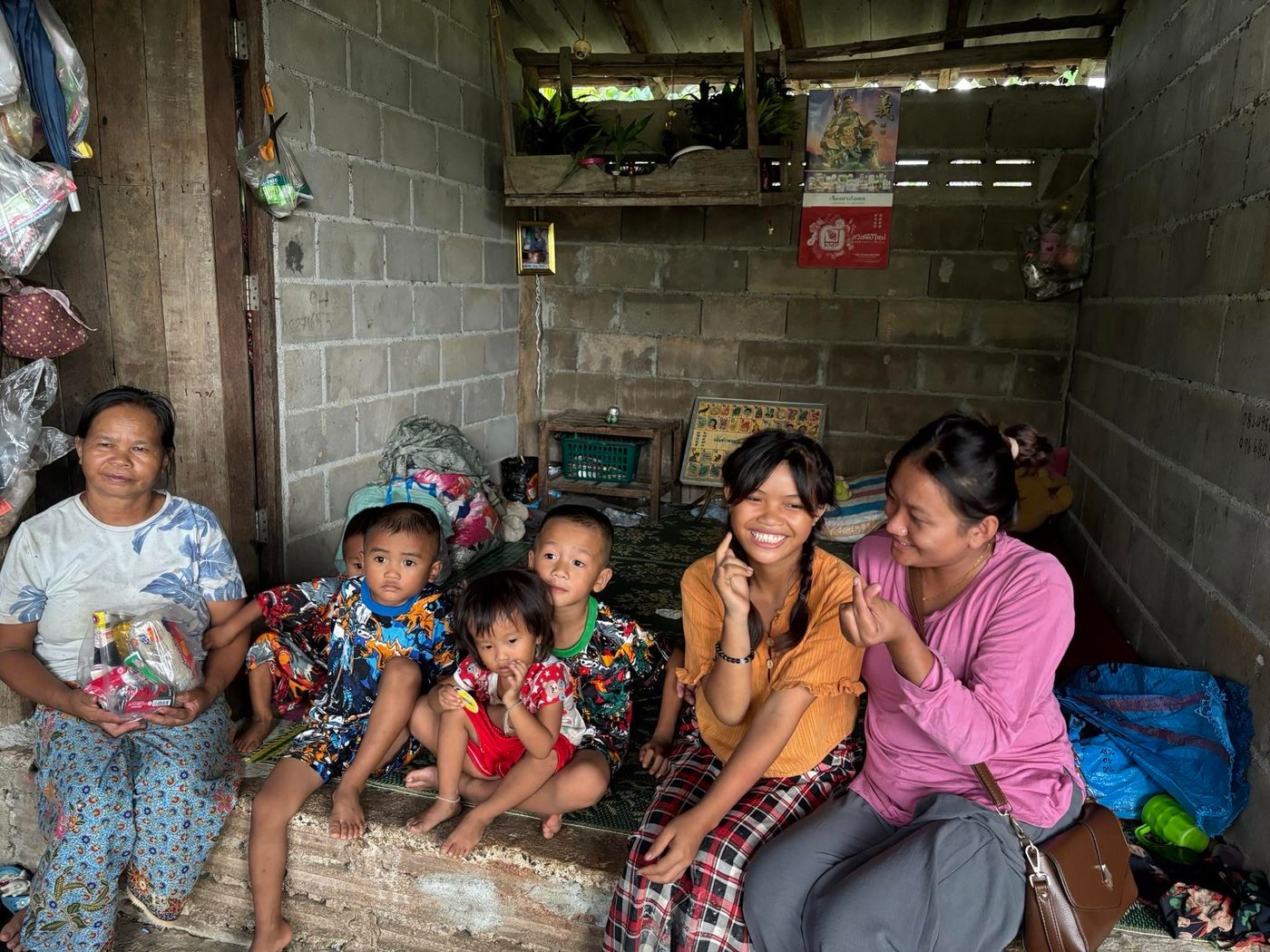 An outreach team visiting a family at home with food and supplies